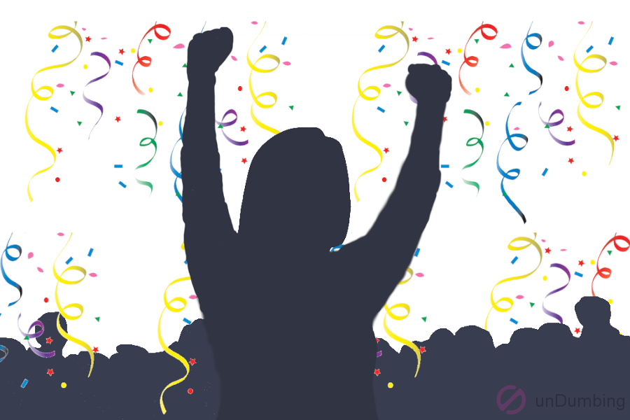 Person cheering in front of a crowd with confetti in the background