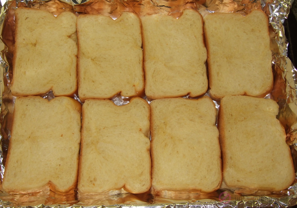 Eight slices of brioche in a baking pan