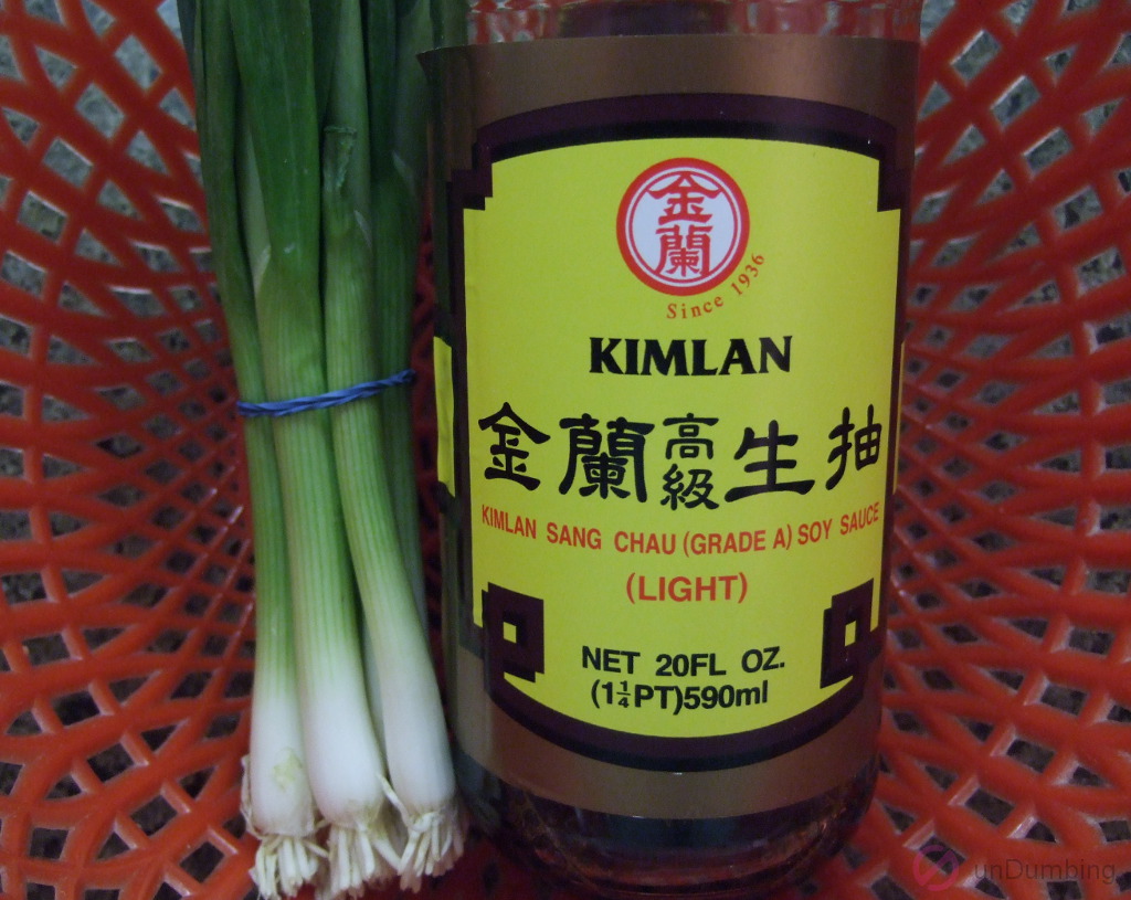 Green onions and soy sauce in a basket
