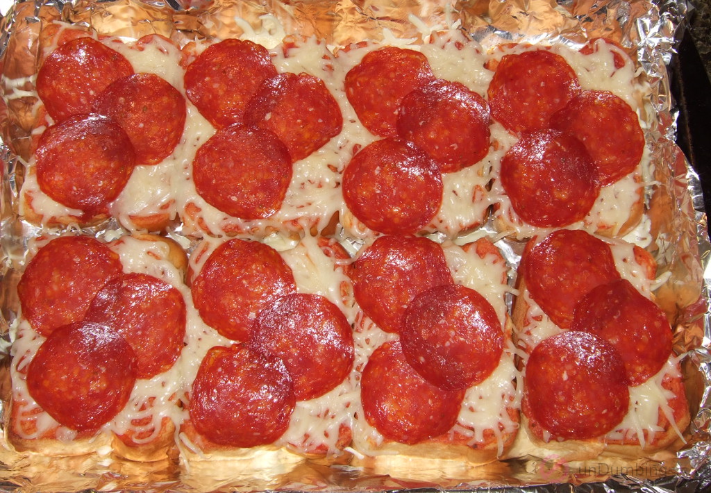 Eight slices of pizza toast in a baking pan