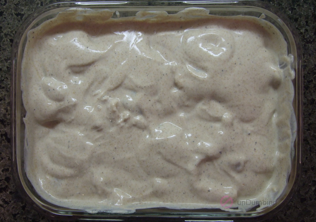 Chicken marinating in glass container