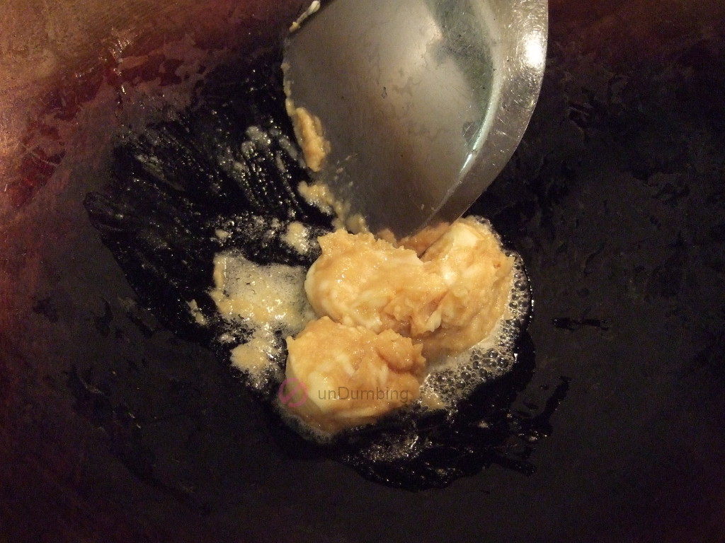 Miso butter heating in a wok