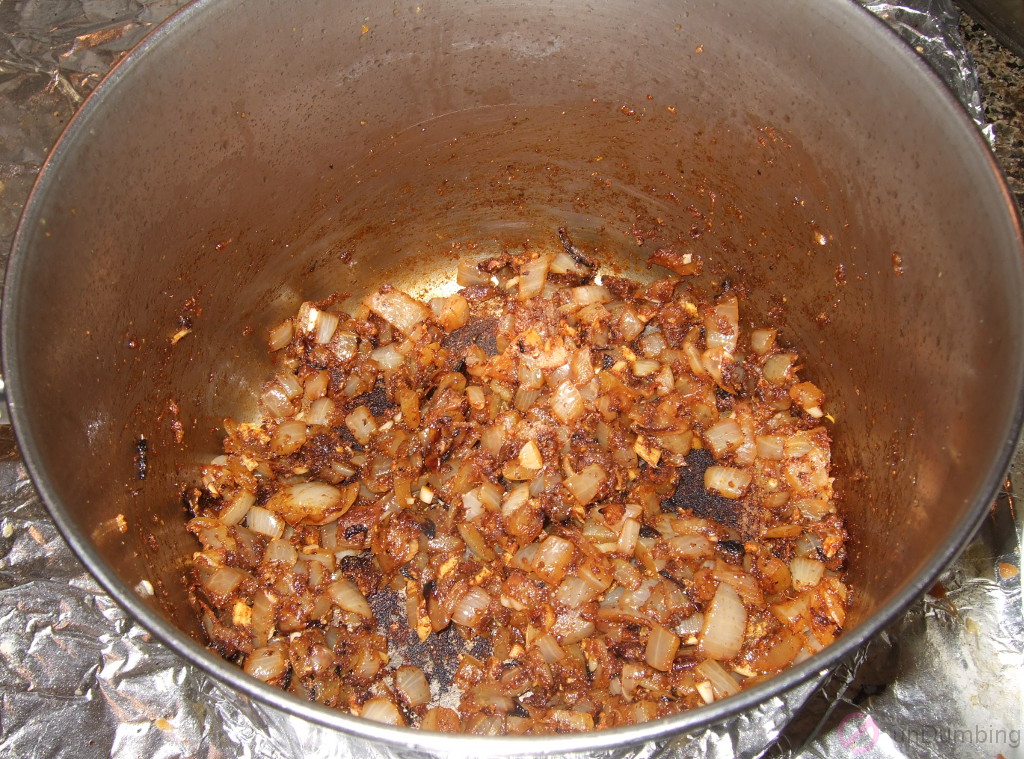 Onion, garlic, ginger, and spices combined in a pot