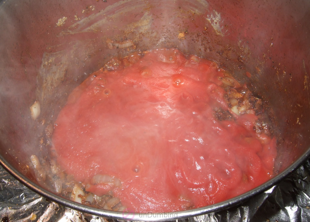 Tomato sauce added to the pot