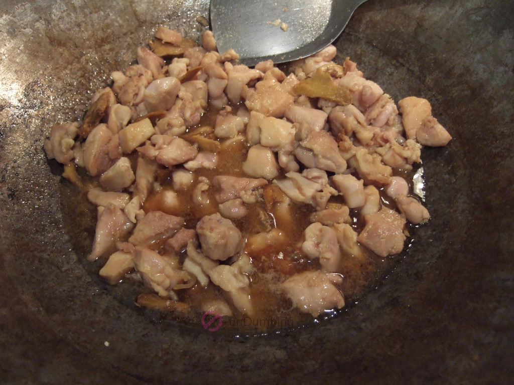 Chicken cooked through in the wok