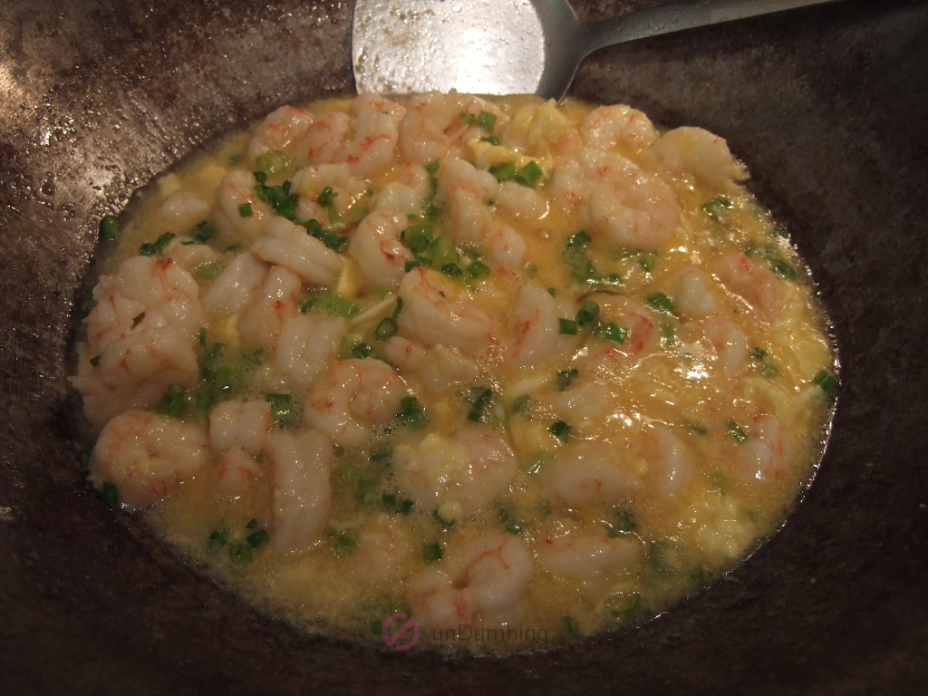 Cooked shrimp and eggs in a wok