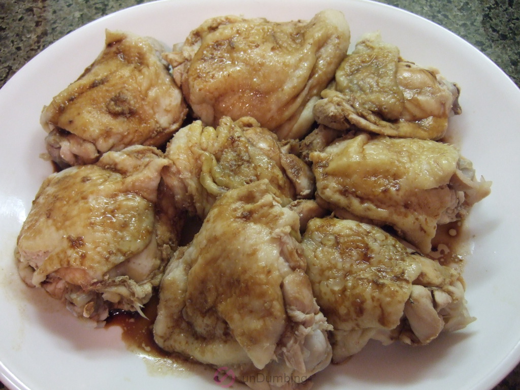 Plate of chicken thighs with soy sauce and sesame oil