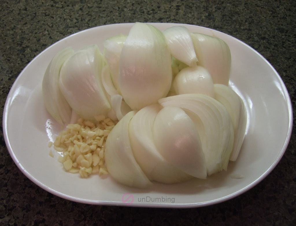 Plate of sliced onions and chopped garlic
