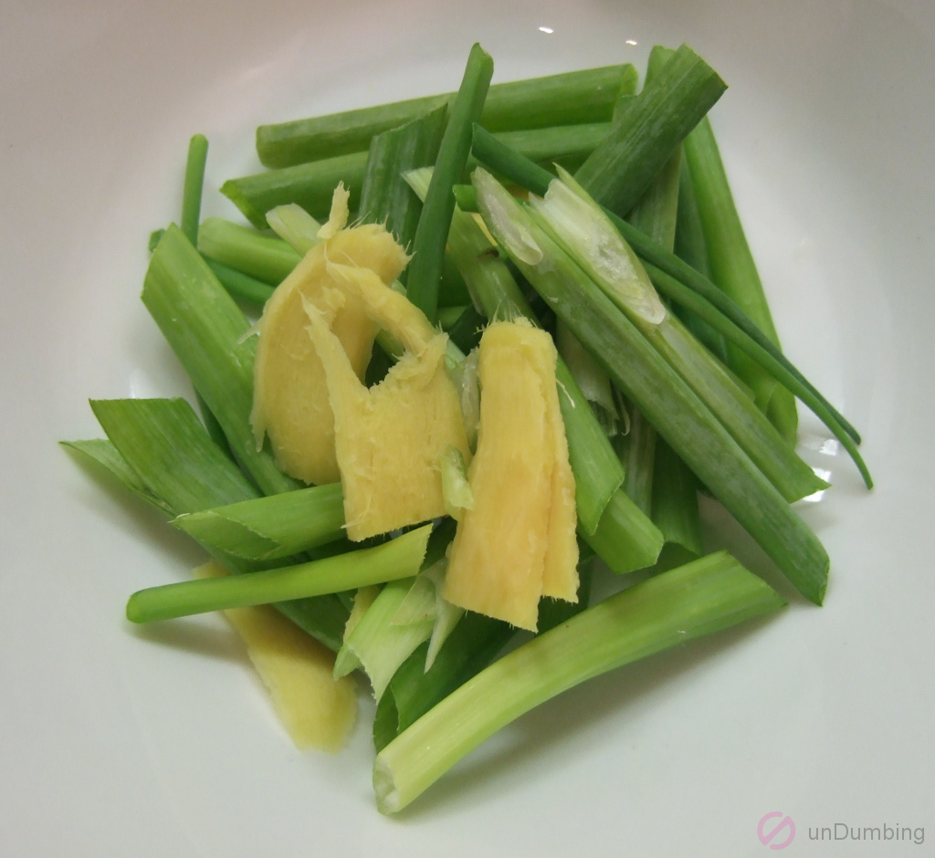 Ginger and green onions in a bowl