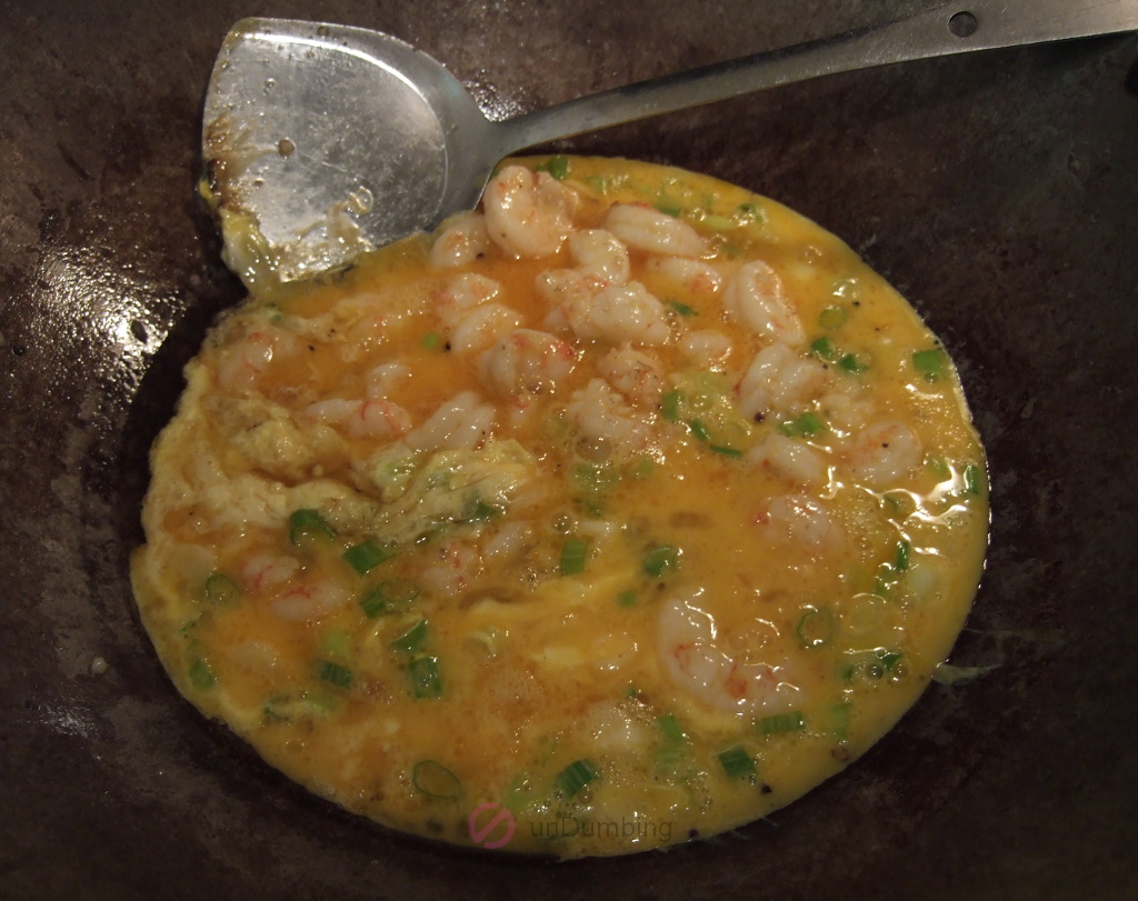 Shrimp and egg mixture in a wok