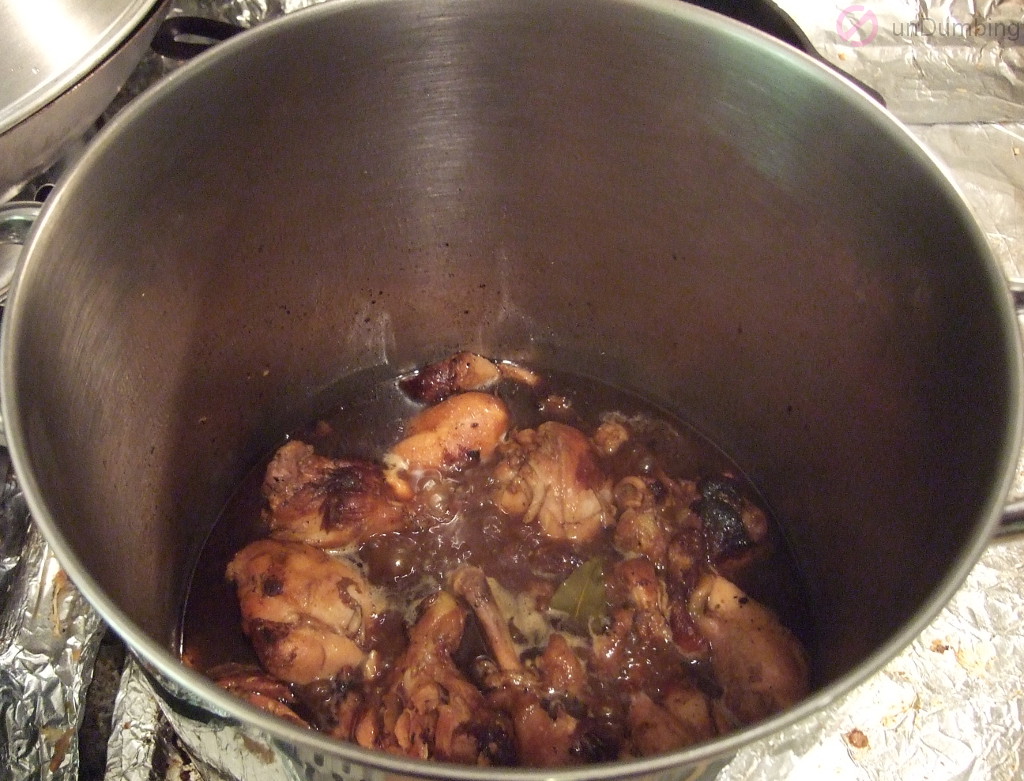Pot of chicken stirred with vinegar