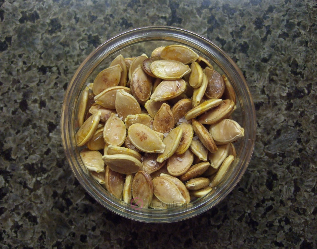 Baked salted kabocha seeds in a glass container