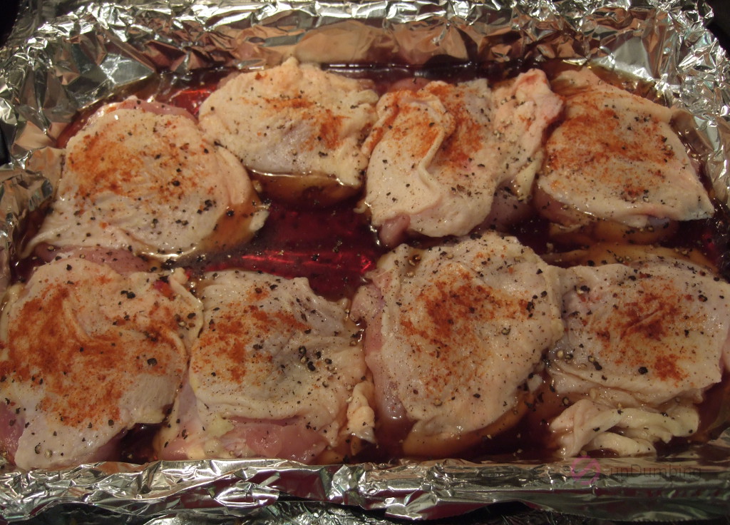 Chicken thighs in a baking pan ready to bake