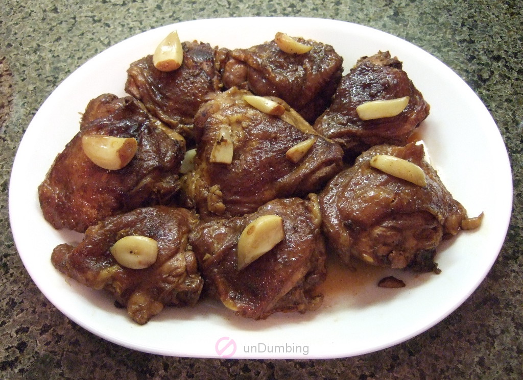 Plate of chicken adobo garnished with garlic (Try 2)