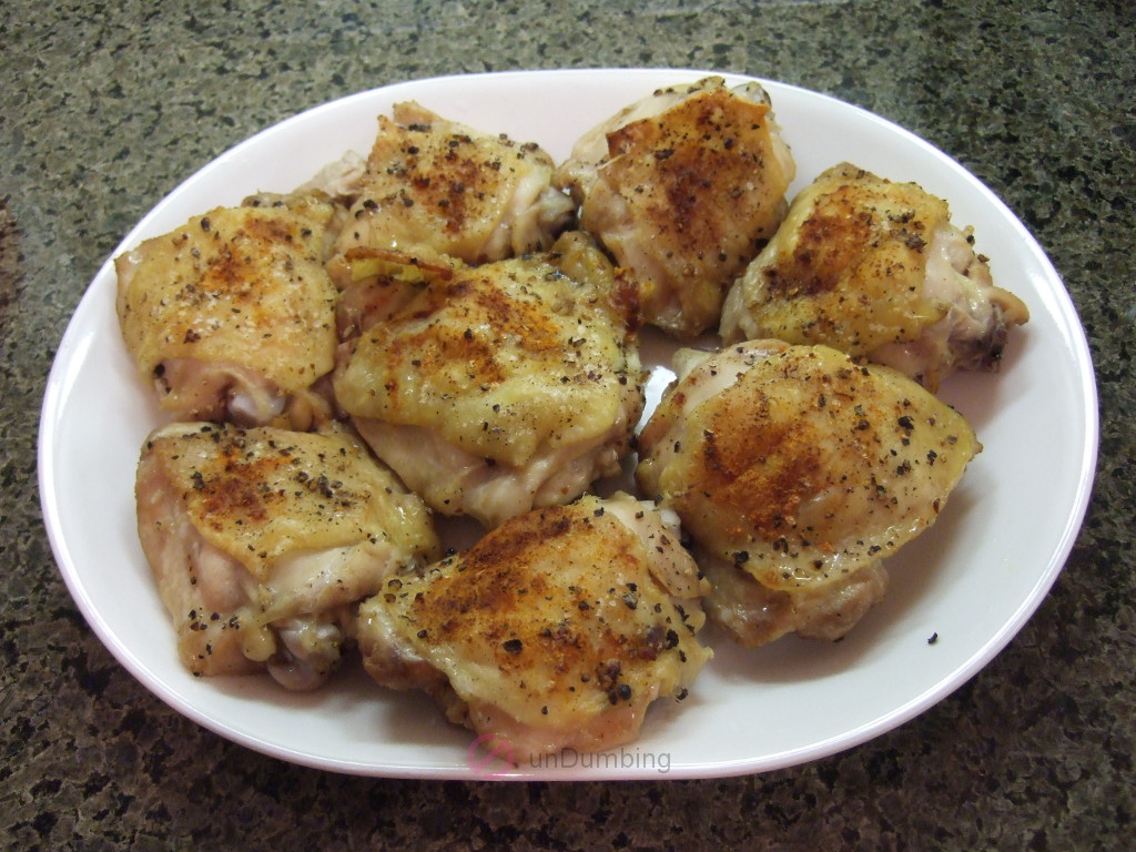 Plate of baked chicken thighs