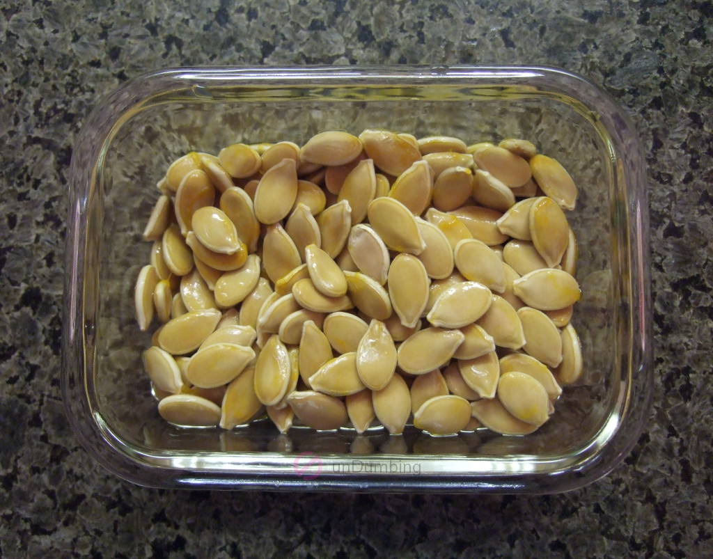 Rinsed kabocha seeds in a glass container