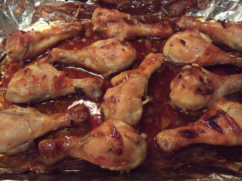Baked chicken drumsticks in a baking pan