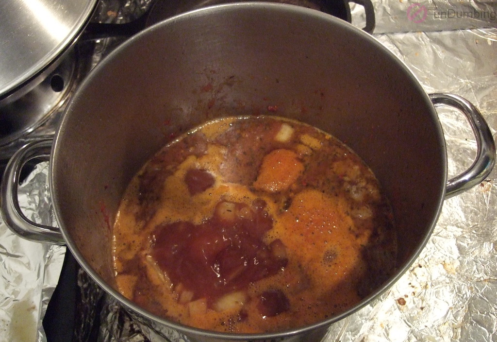 Beef bone broth boiling in the pot