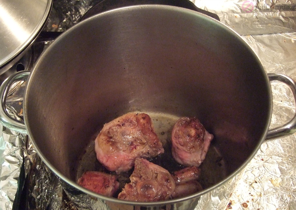 Browning oxtail in a pot