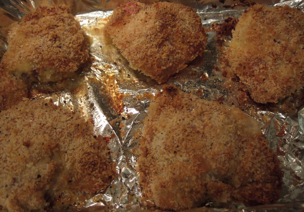 Oven-fried chicken on foil-lined baking pan