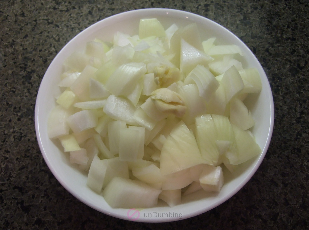 Chopped onions and crushed garlic in a bowl