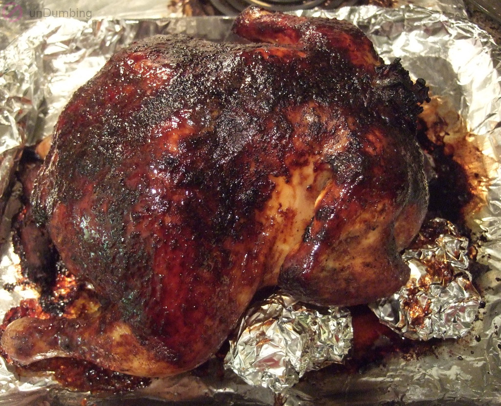 Roasted chicken resting on a baking sheet