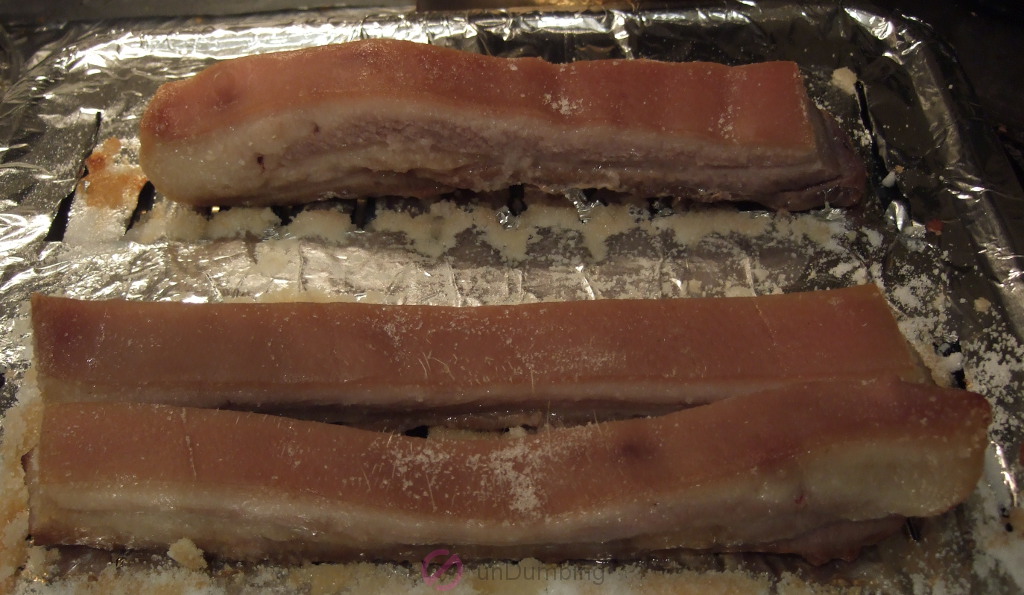 Baked pork belly without salt crust on a slotted pan