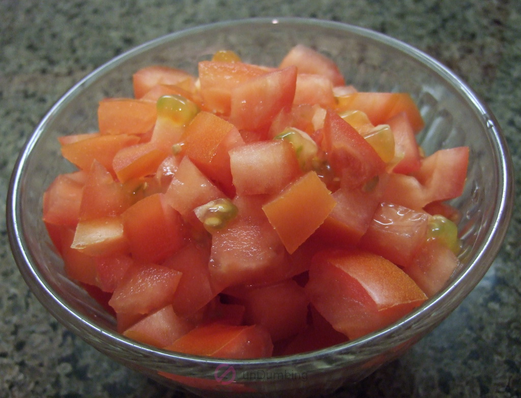 Chopped tomatoes in a glass bowl