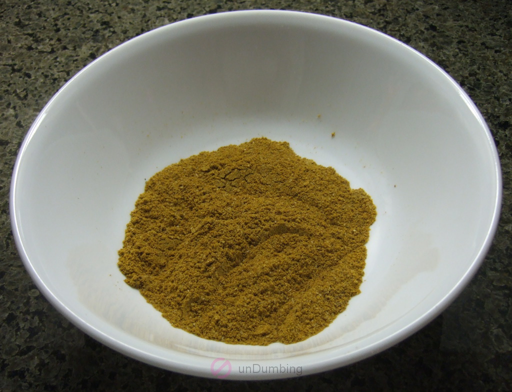 Bowl of salt, garam masala, curry powder, and cumin mixed together