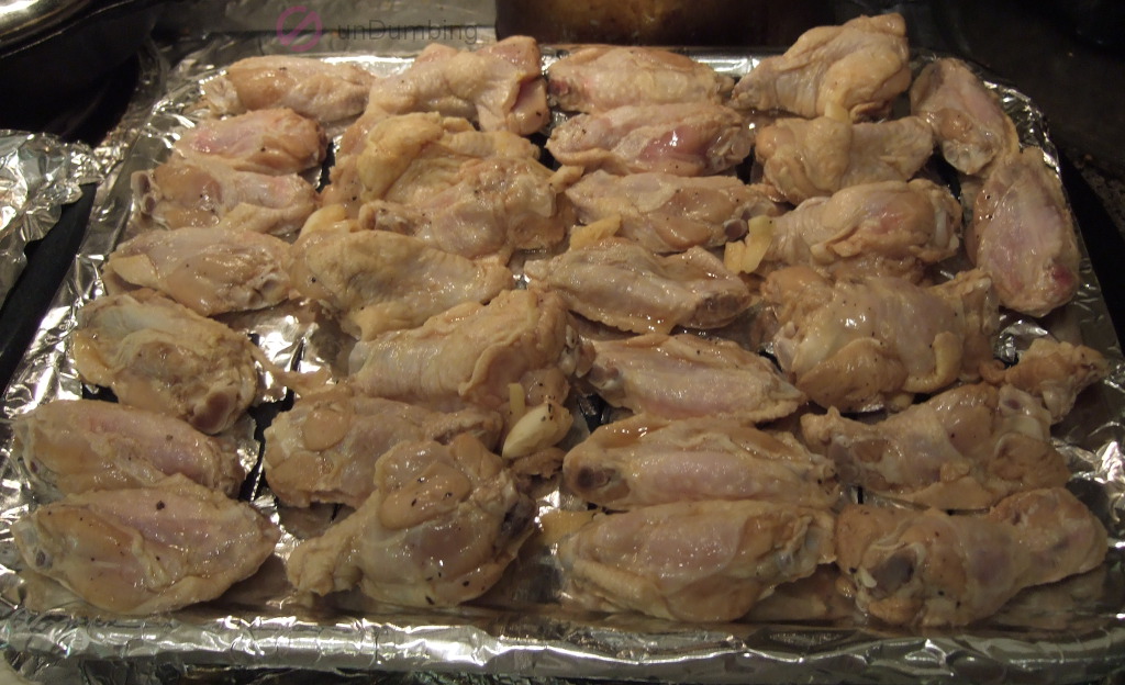 Wings on a foil-lined broiler pan