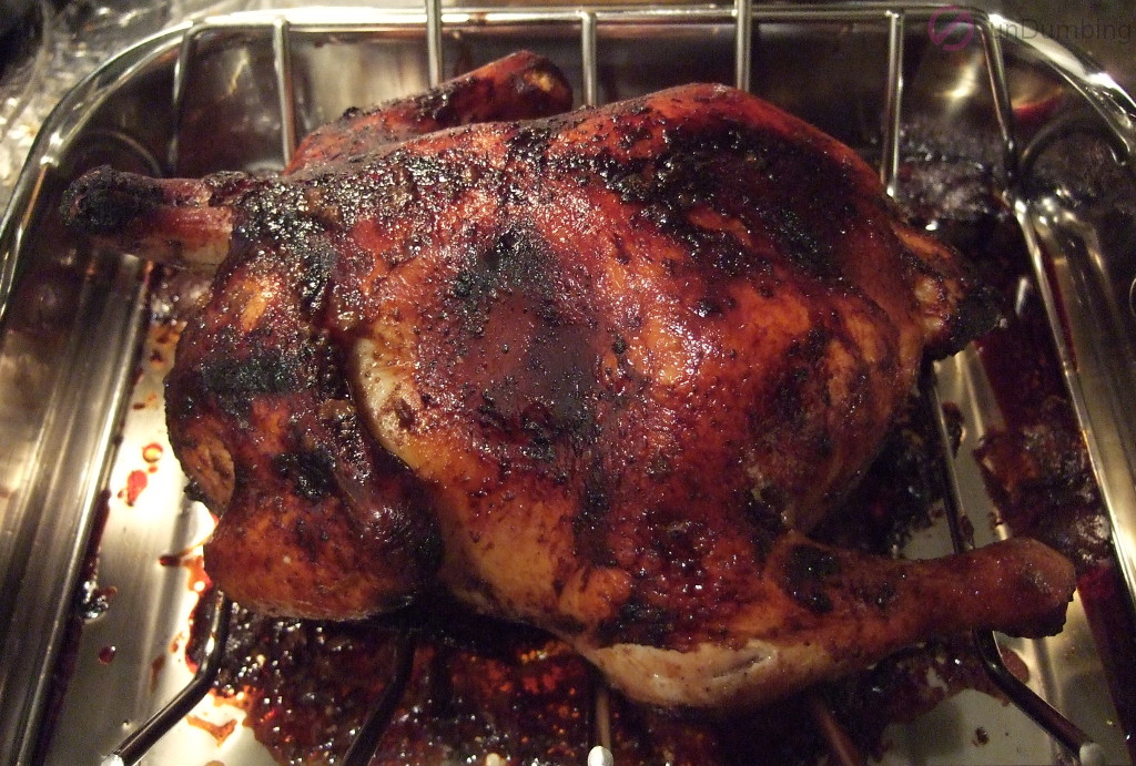 Cooked chicken on a roasting rack