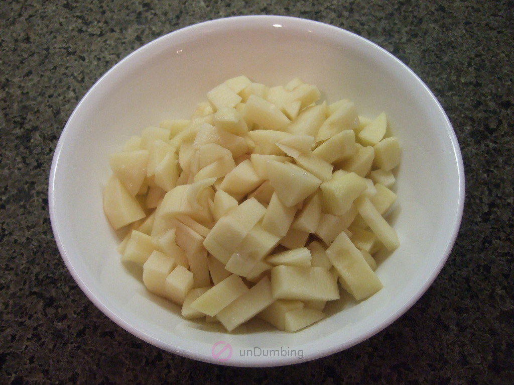 Chopped potatoes in a white bowl