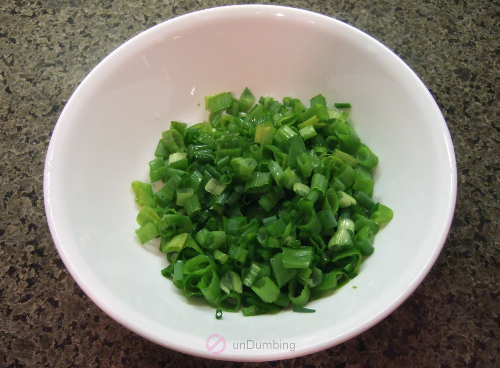 Chopped scallions in a white bowl