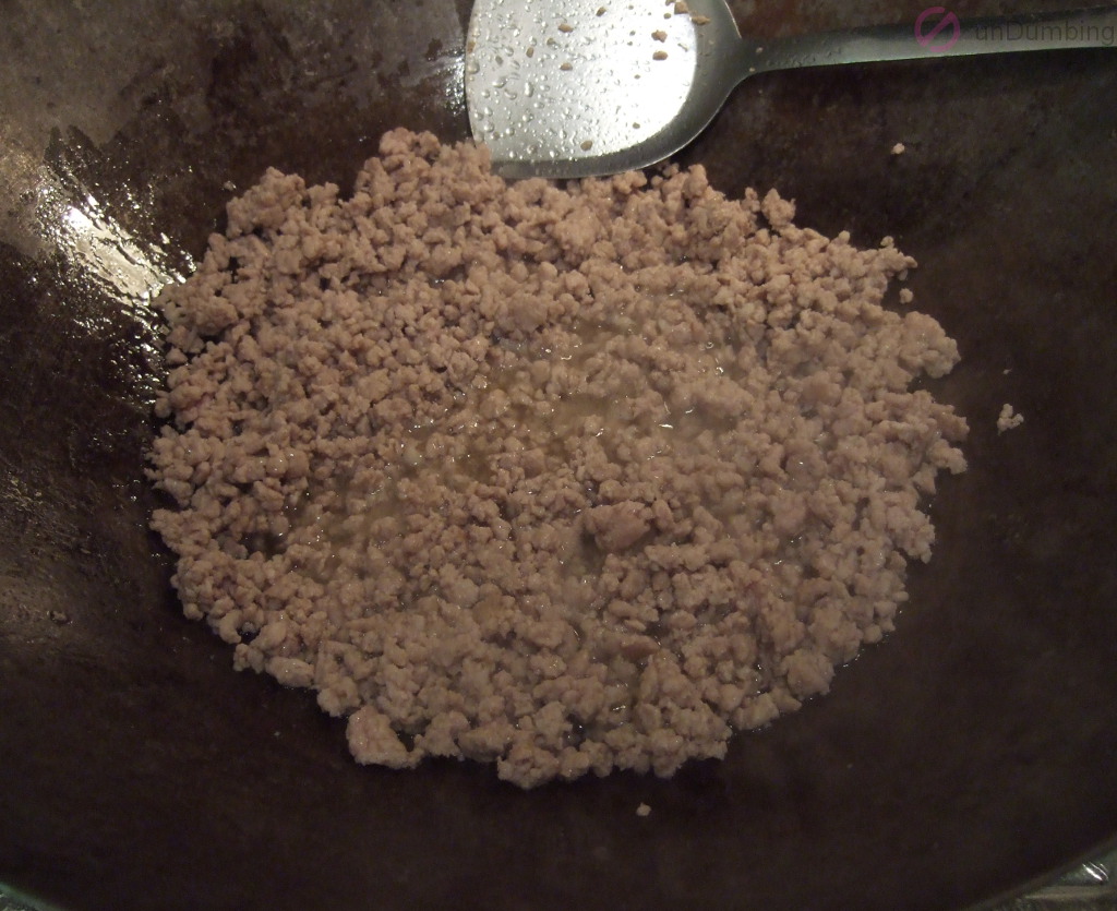 Browned ground pork in a wok