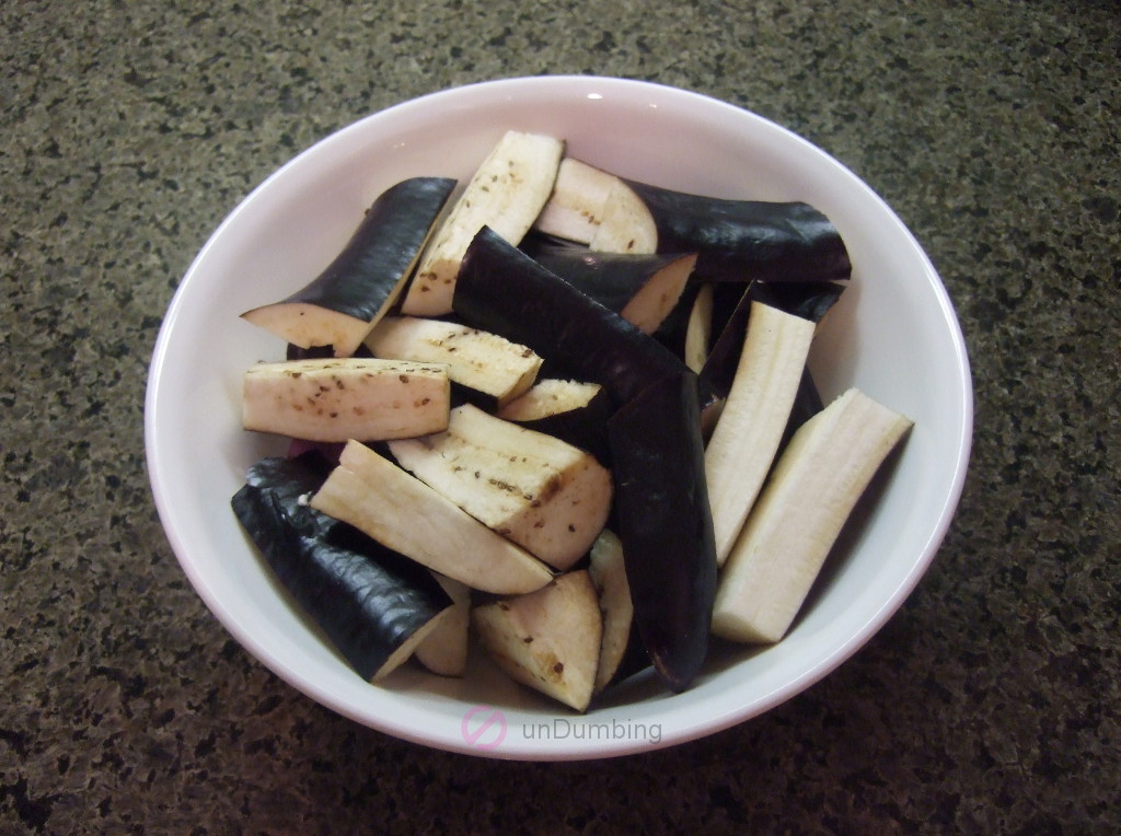Drained eggplant in a white bowl