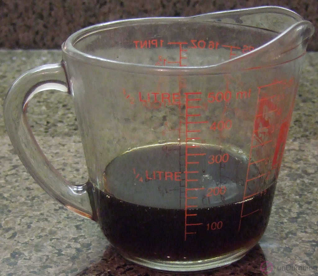 Measuring cup with honey and soy sauce