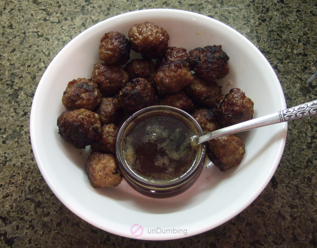 Meatballs with dipping sauce in a white bowl (Try 2)