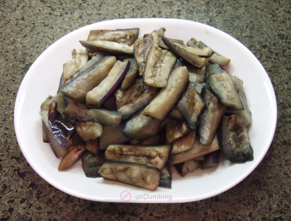 Steamed eggplant on a white plate
