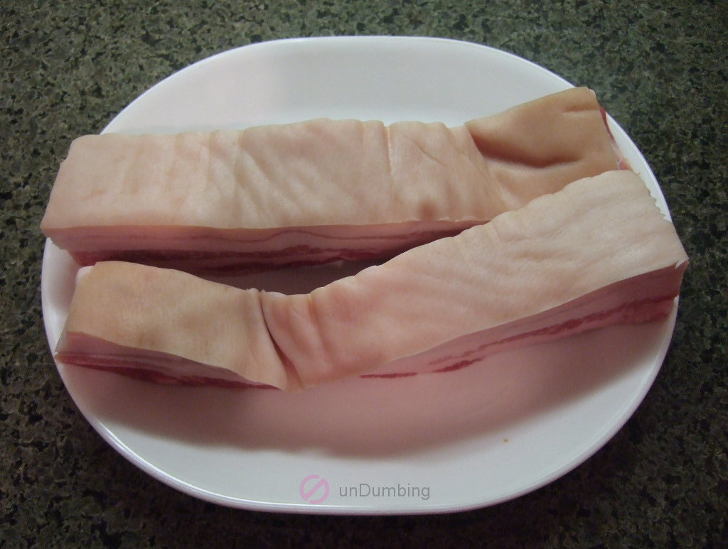Dry pork belly on a white plate