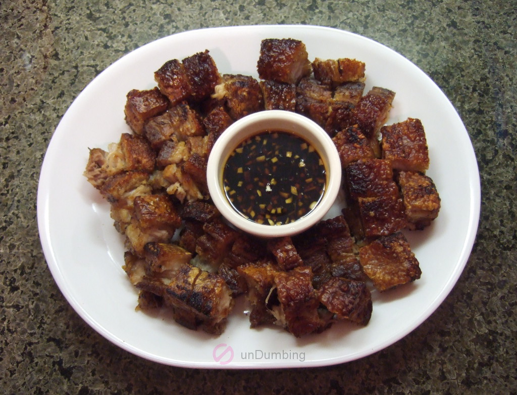 Sliced pork belly with honey garlic sauce on a white plate (Try 2)