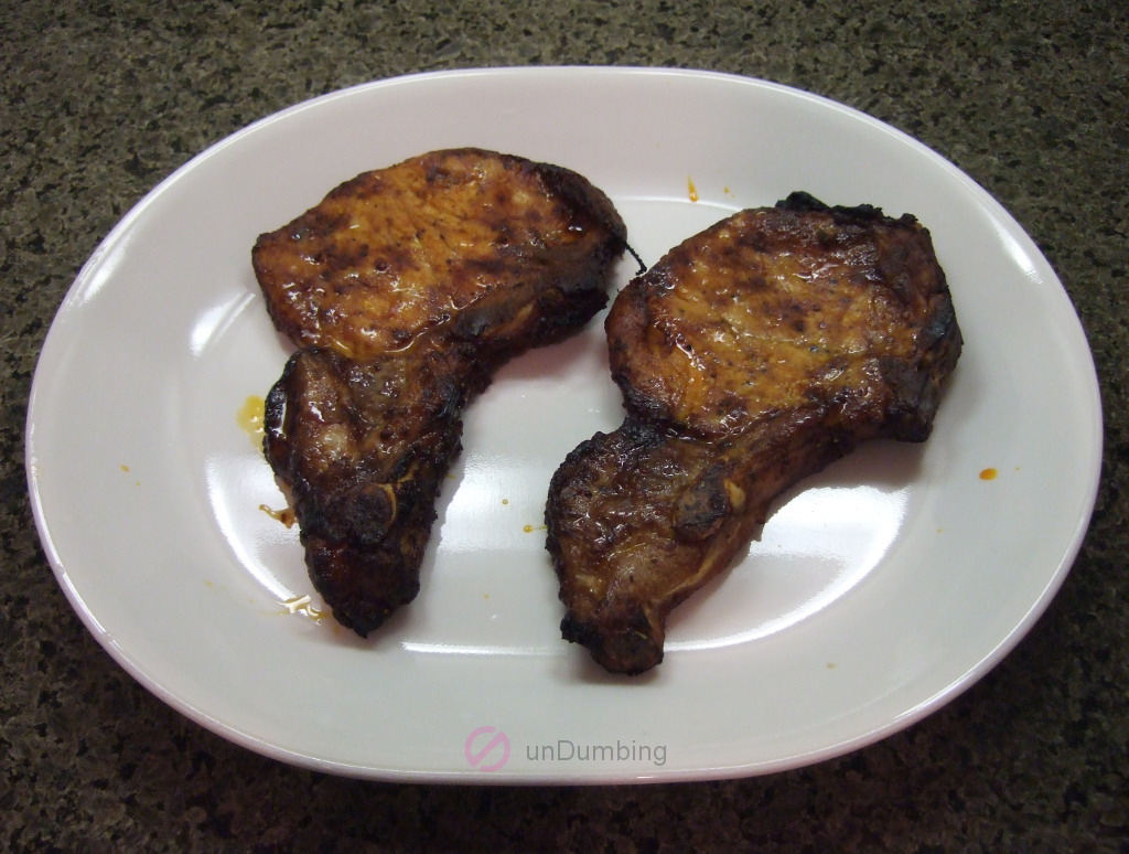 Baked pork chops on a white plate (Try 2)