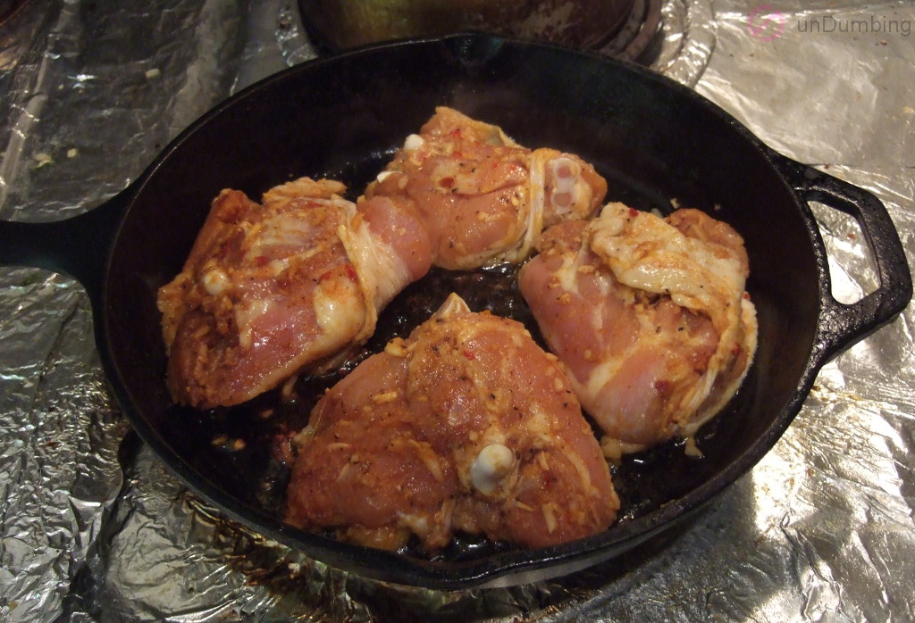 Browning chicken thighs in a skillet