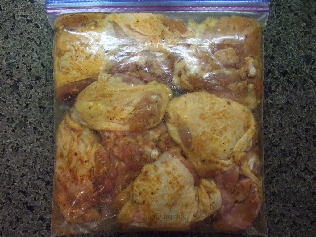 Plastic bag of chicken thighs coated in homemade seasoned salt