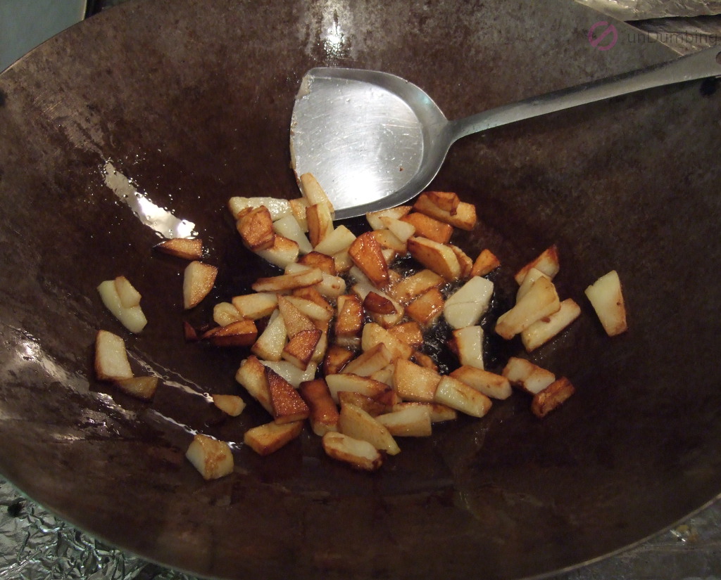 Cooked potatoes in a wok