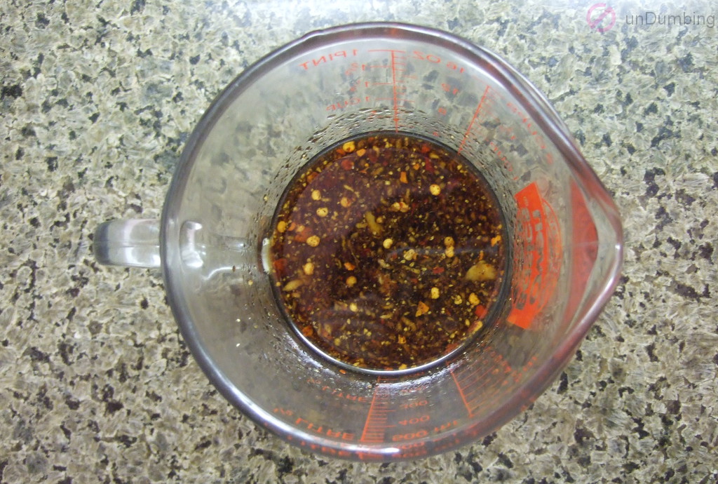 Whisked brown sugar, soy sauce, sesame oil, ginger, red pepper flakes, and pepper in a glass measuring cup