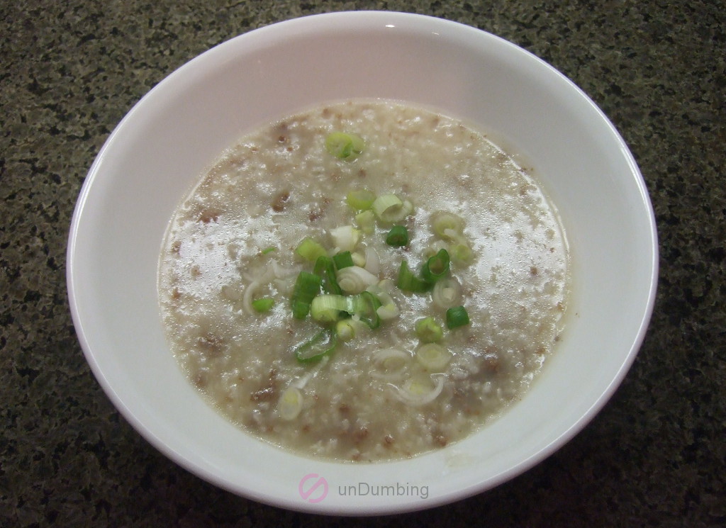 Beef congee in a white bowl