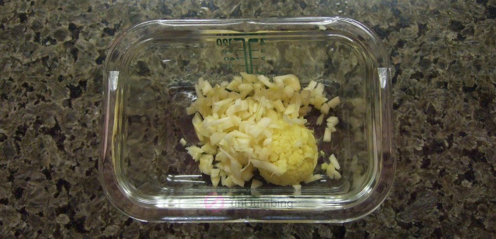 Chopped garlic and grated ginger in a small glass tub