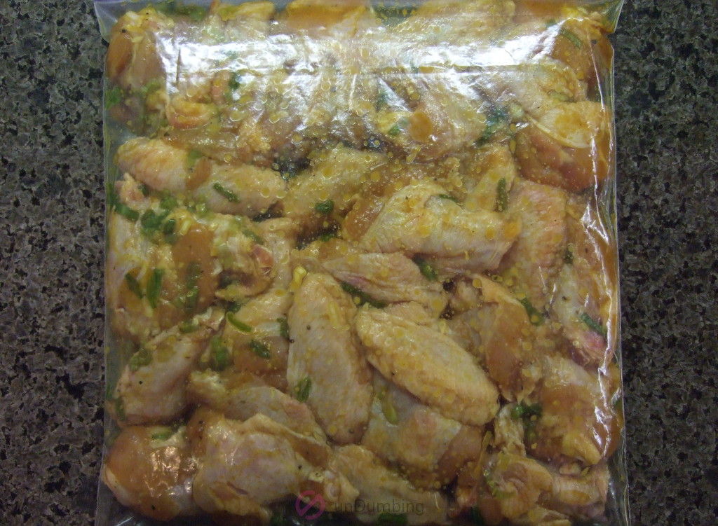 Chicken wings marinating in a clear bag