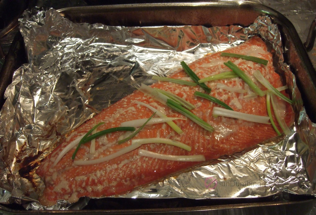 Garnished salmon on a foil-lined roasting pan (Try 2)