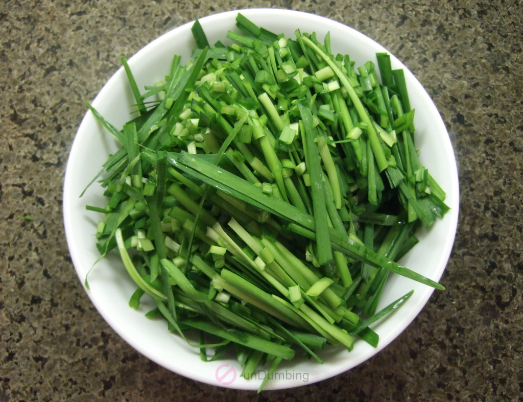 Chopped Chinese chives in a white bowl